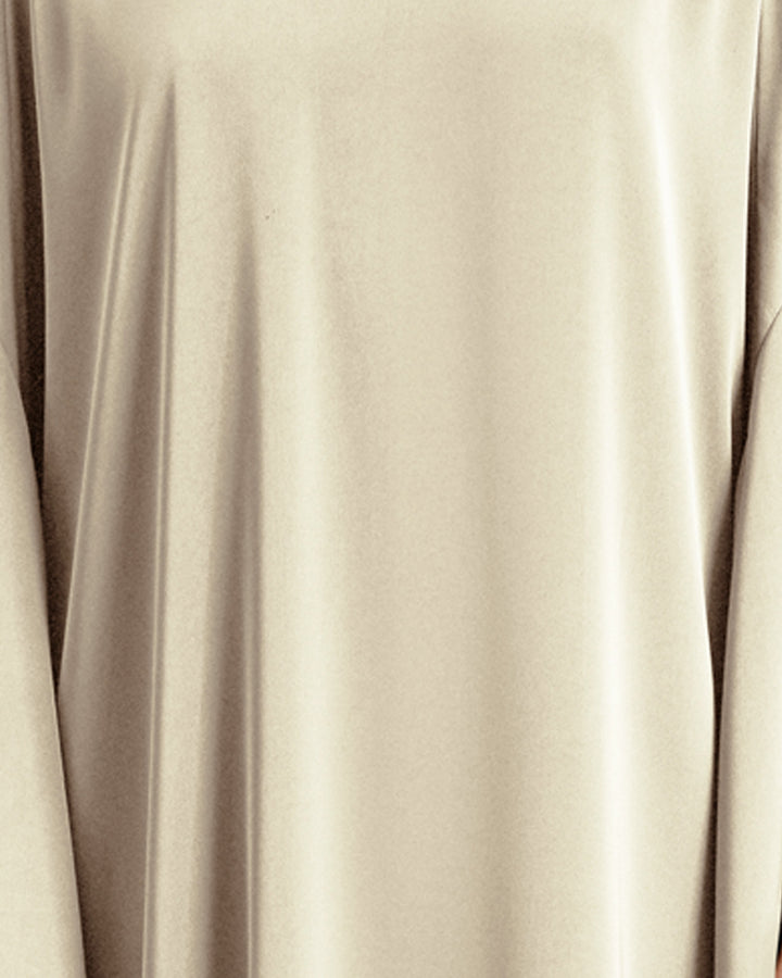 A close-up of a cream color satin fabric.