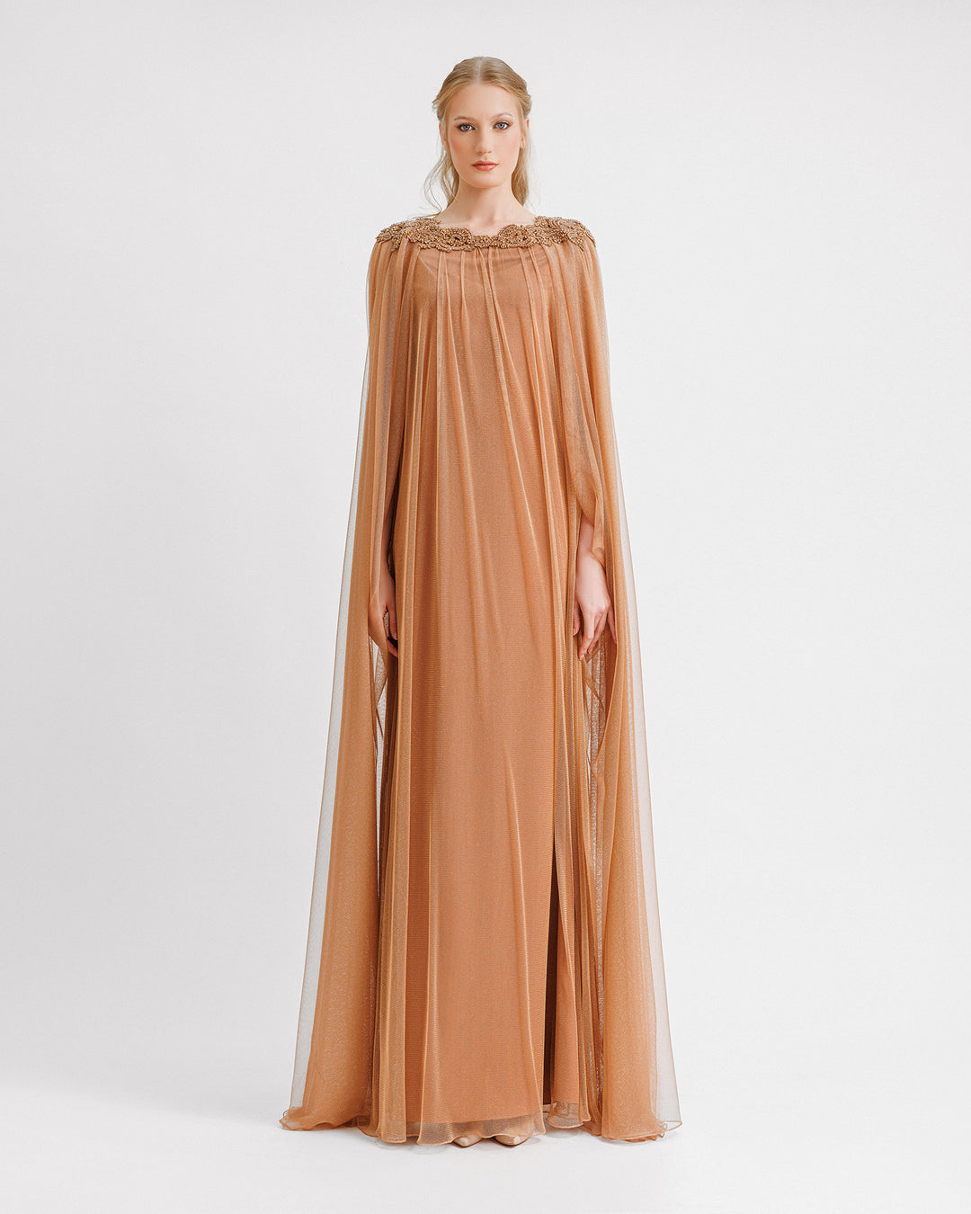 A loose-cut kaftan style copper evening dress with beadings at the neckline.