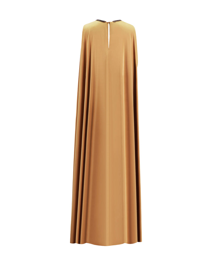 The back of a caramel color kaftan-style evening dress with a beaded neckline.