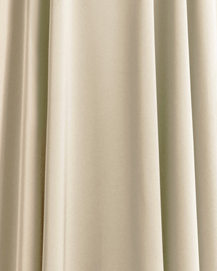 A close-up of a cream color satin fabric.