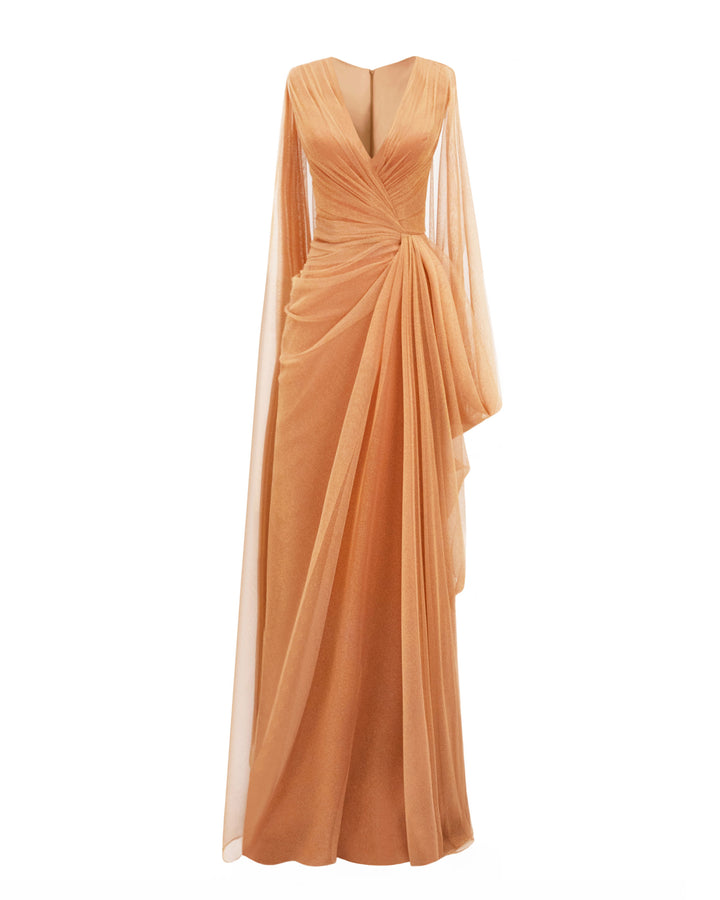 A V-neckline draped shiny tulle evening dress in copper color with asymmetrical cape-like sleeves.