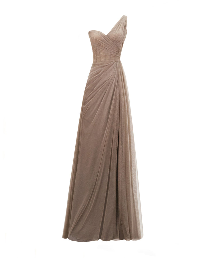 A one-shoulder draped shiny tulle dress in taupe color featuring a slit on the side.