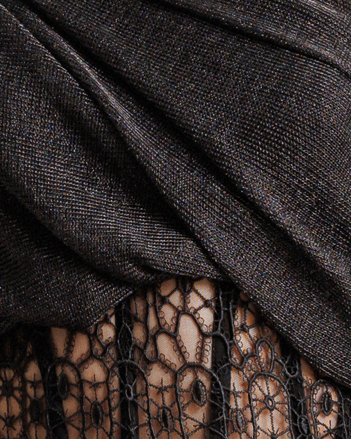 A close-up of a black fabric with embroidery.