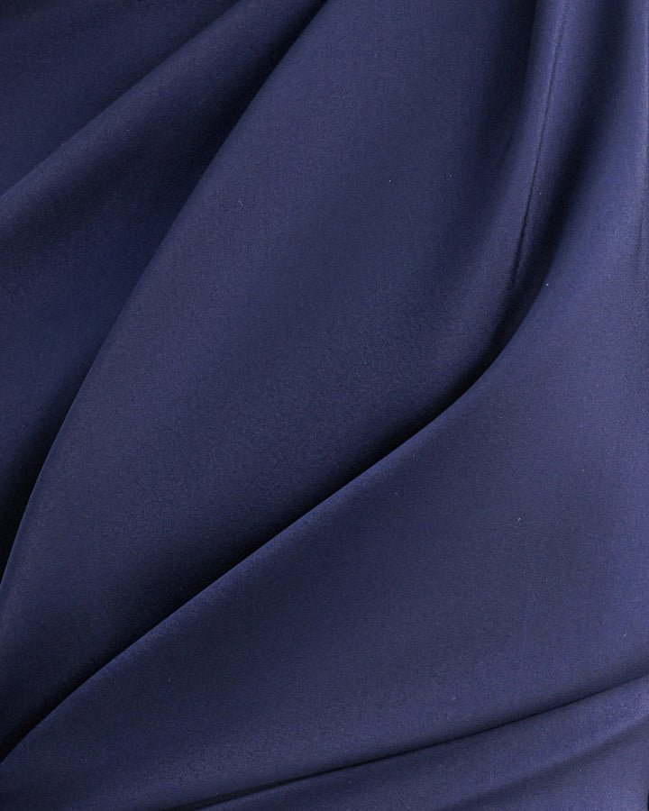 A close-up of a navy satin fabric.