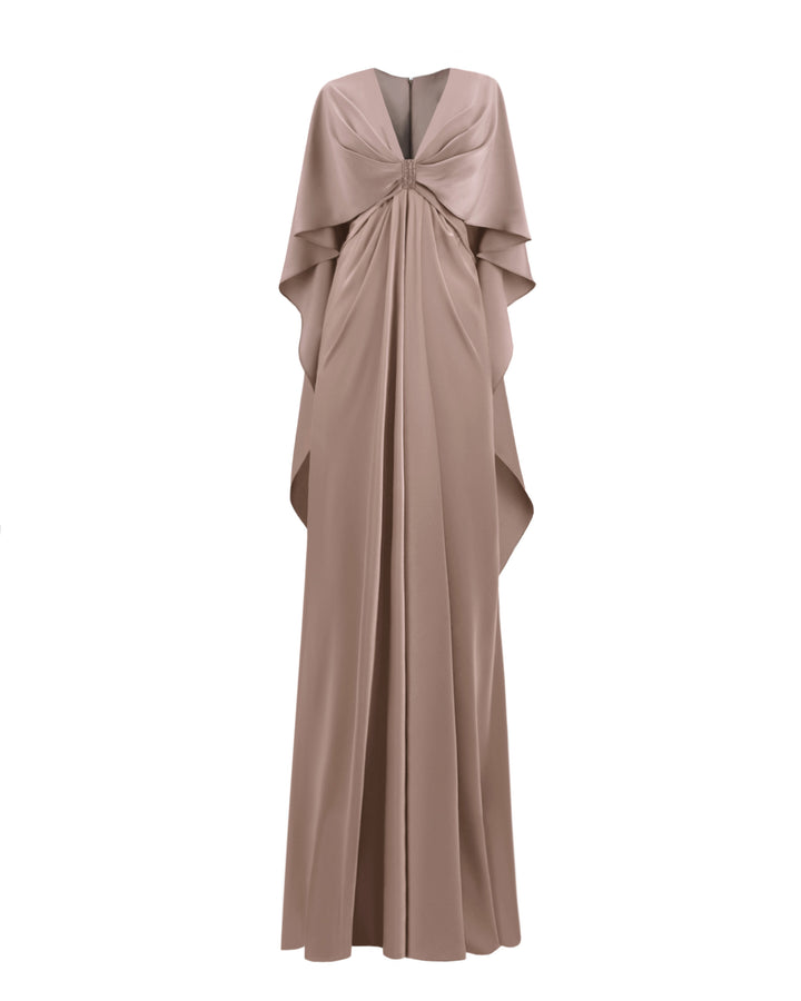 A V-neckline draped satin evening dress in taupe color with ruffled cape-like sleeves and beadings at the front.