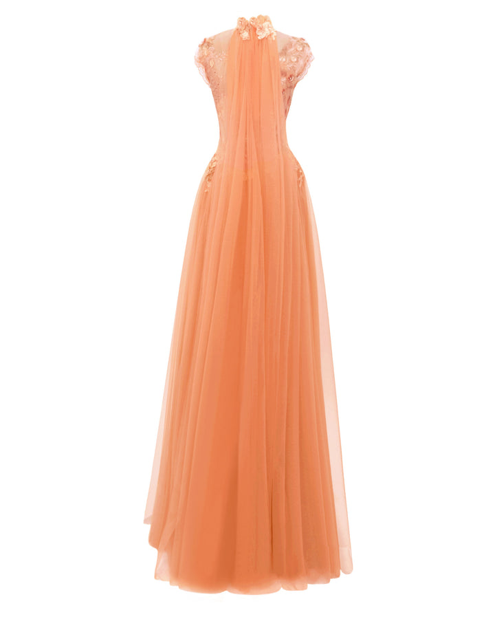 The back of a fully embellished floral see-through corset evening dress in peach color with a high-collar, tulle train going down the back neckline, and flared tulle skirt.