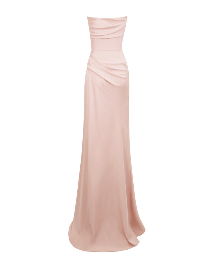 The back of a strapless, straight cut blush long evening dress, with bust line, and some draping details from the bust going down the waist.