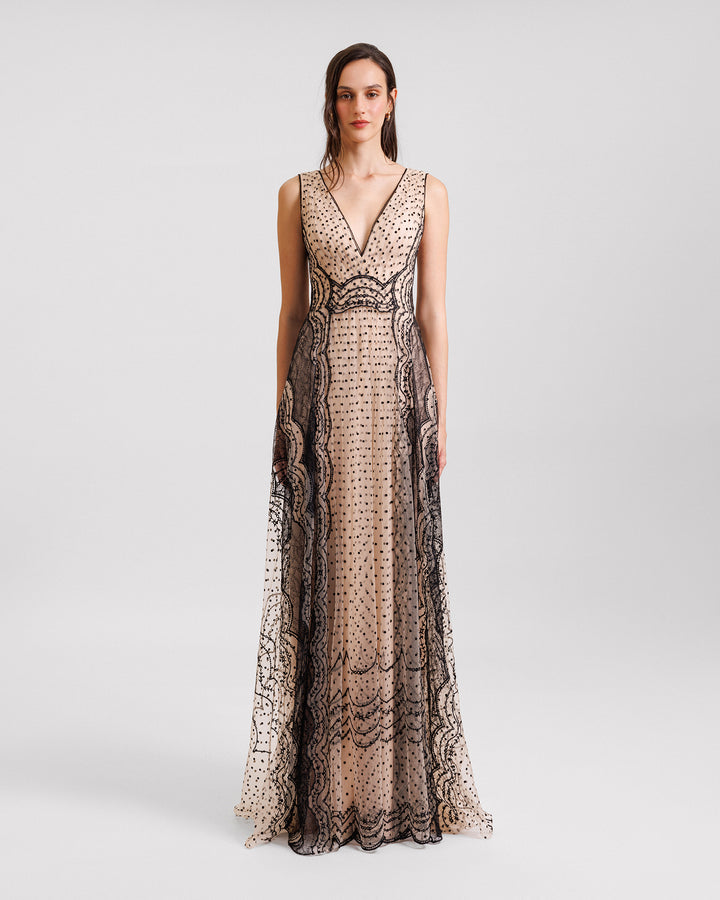 An embroidered V-neckline black and beige evening dress.