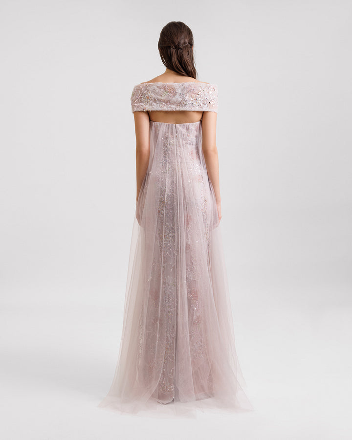 The back of an off-the-shoulders beaded embroidery dress in dusty pink with a loose tulle overlay.