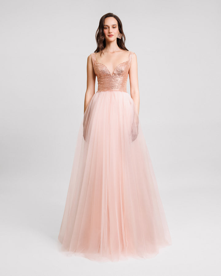 A v-neckline evening dress with a stone embellished corset and a full tulle skirt.