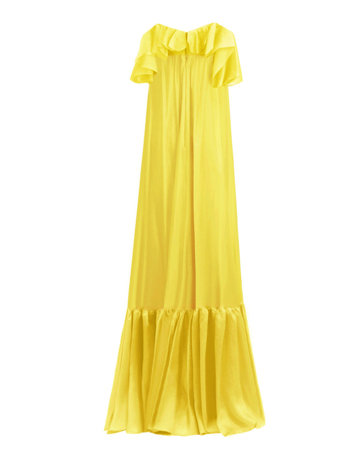 The back of a ruffled off-the-shoulders flowy yellow evening dress with a draped hemline.