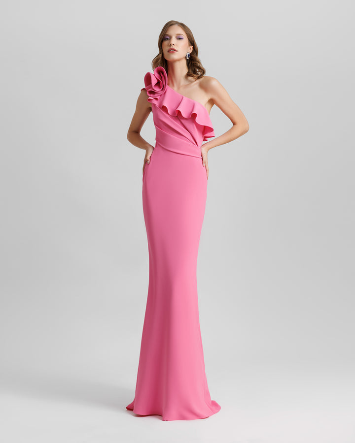 A one-shoulder pink evening dress with draping on the waist, and a ruffled neckline that goes all the way to the back.