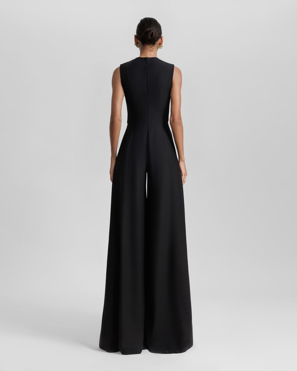 The back of a black jumpsuit.