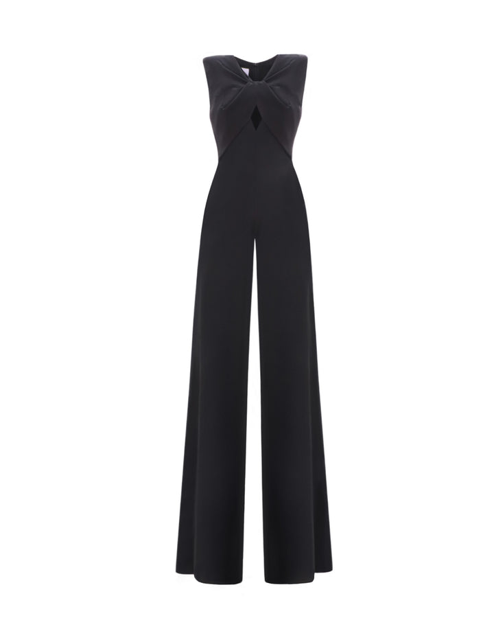 A black jumpsuit featuring pockets, a cut-out and a bow design at the front.