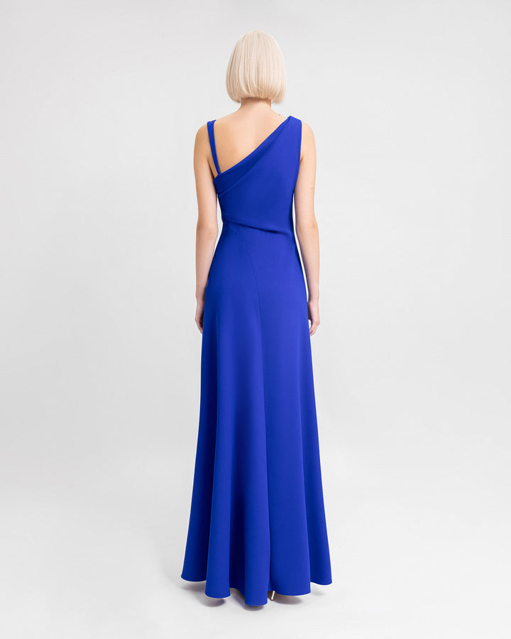 The back of a blue evening dress with asymmetrical open back.