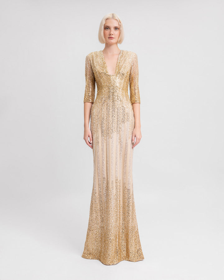 A fully beaded v-neckline golden dress with three-quarter sleeves.