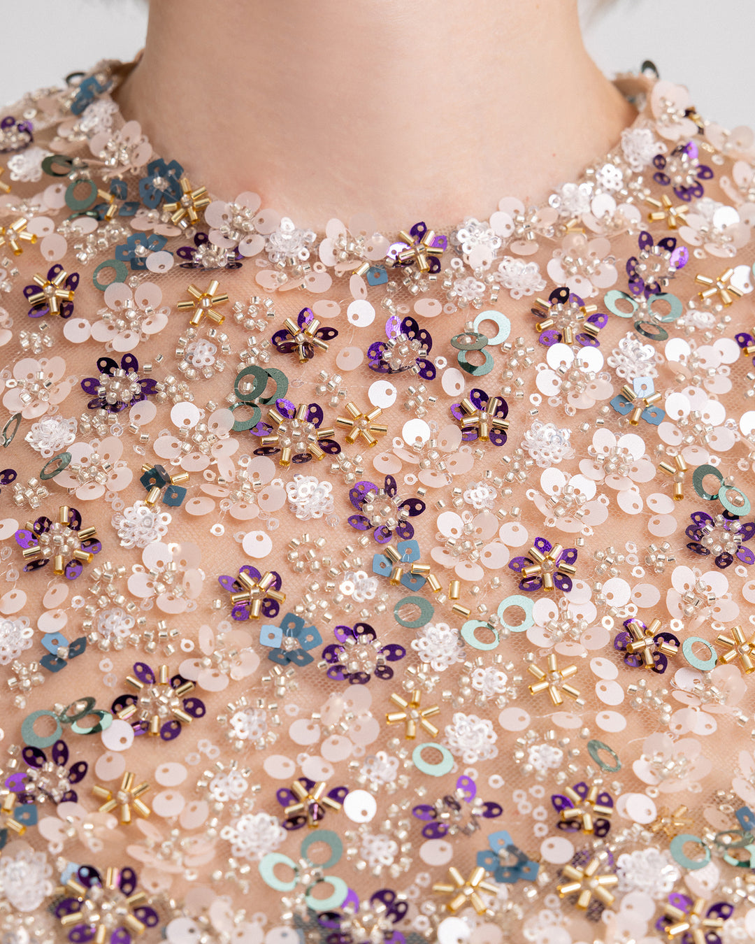 A close-up of a fully beaded fabric.