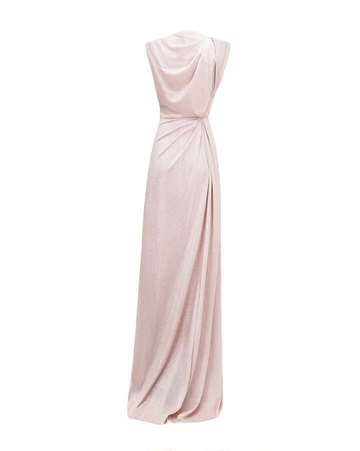 The back of an evening dress in blush color with draping at the waist and back.