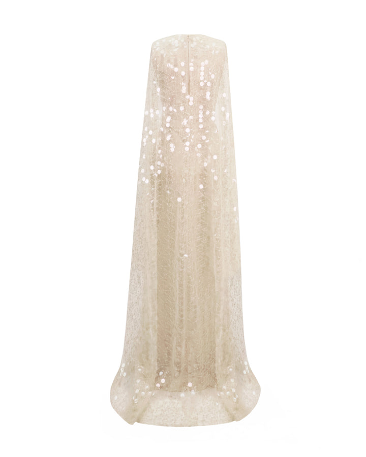 The back of a champagne satin evening dress with a fully sequins embroidered tulle cape.