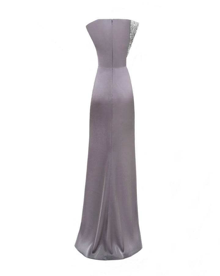 The back of a slim-cut evening dress in smokey grey with a beaded stripe on one side.