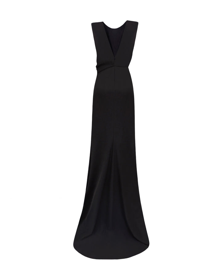 The back of a draped slim-fit black evening dress and a V-shaped open back.