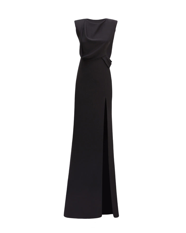 A draped slim-cut black evening dress with a slit on the side.