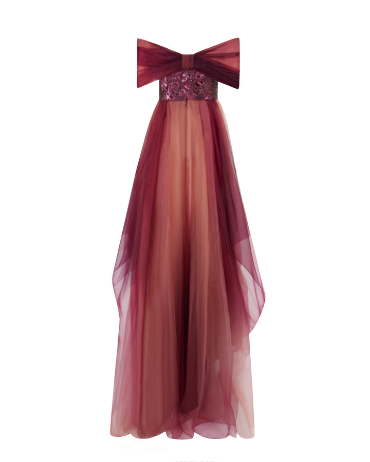 The back of a strapless organza blush aubergine dress, with laser cut intricate bodice, a bow like back design and draping details.