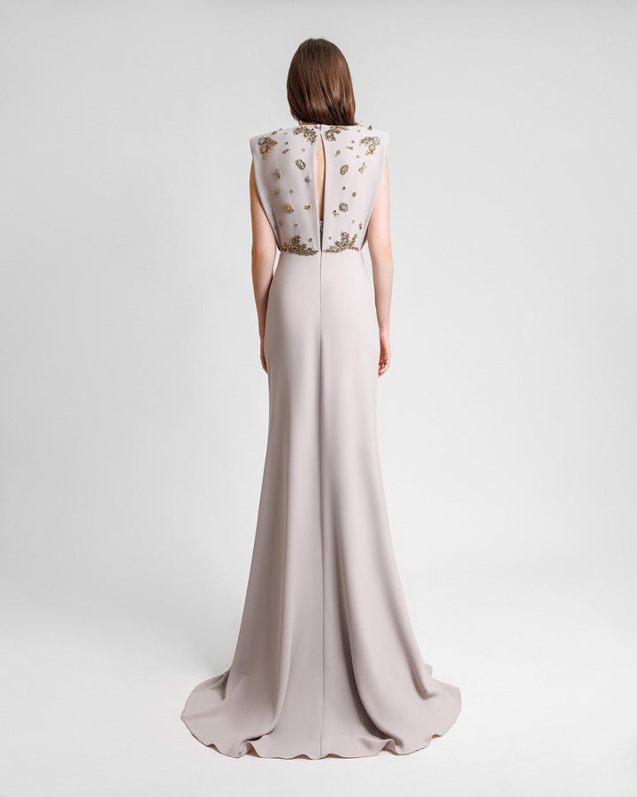 The back of a griege evening dress with a beaded bodice.