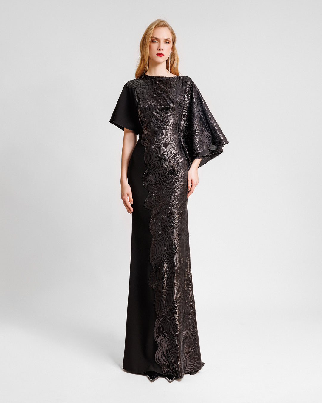 An asymmetrical sleeves, embroidered sequins slim-cut black dress with a black crepe side.