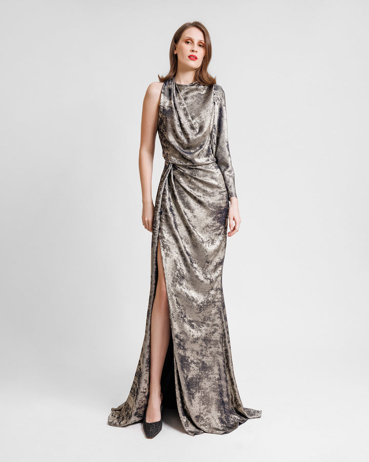 An asymmetrical draped neckline dress featuring a single long sleeve, draping on the waist and a slit on the side.