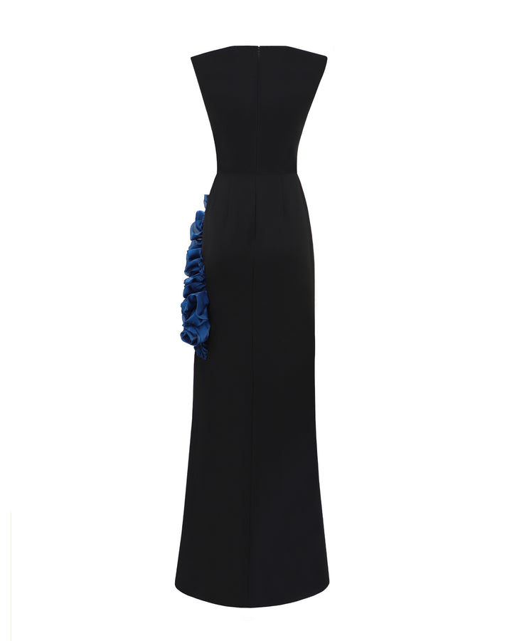 The back of a slim-cut black evening dress featuring petrol floral draping on the side.