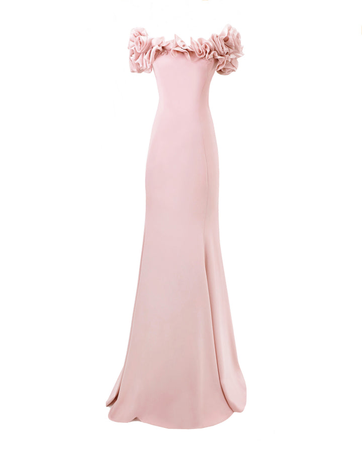 A slim-cut pink evening dress featuring off-the-shoulders floral draping.