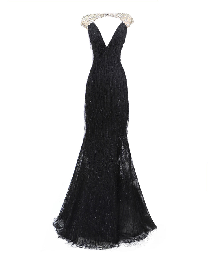 A deep V-neckline black fringes evening dress with a beaded neck and shoulders.