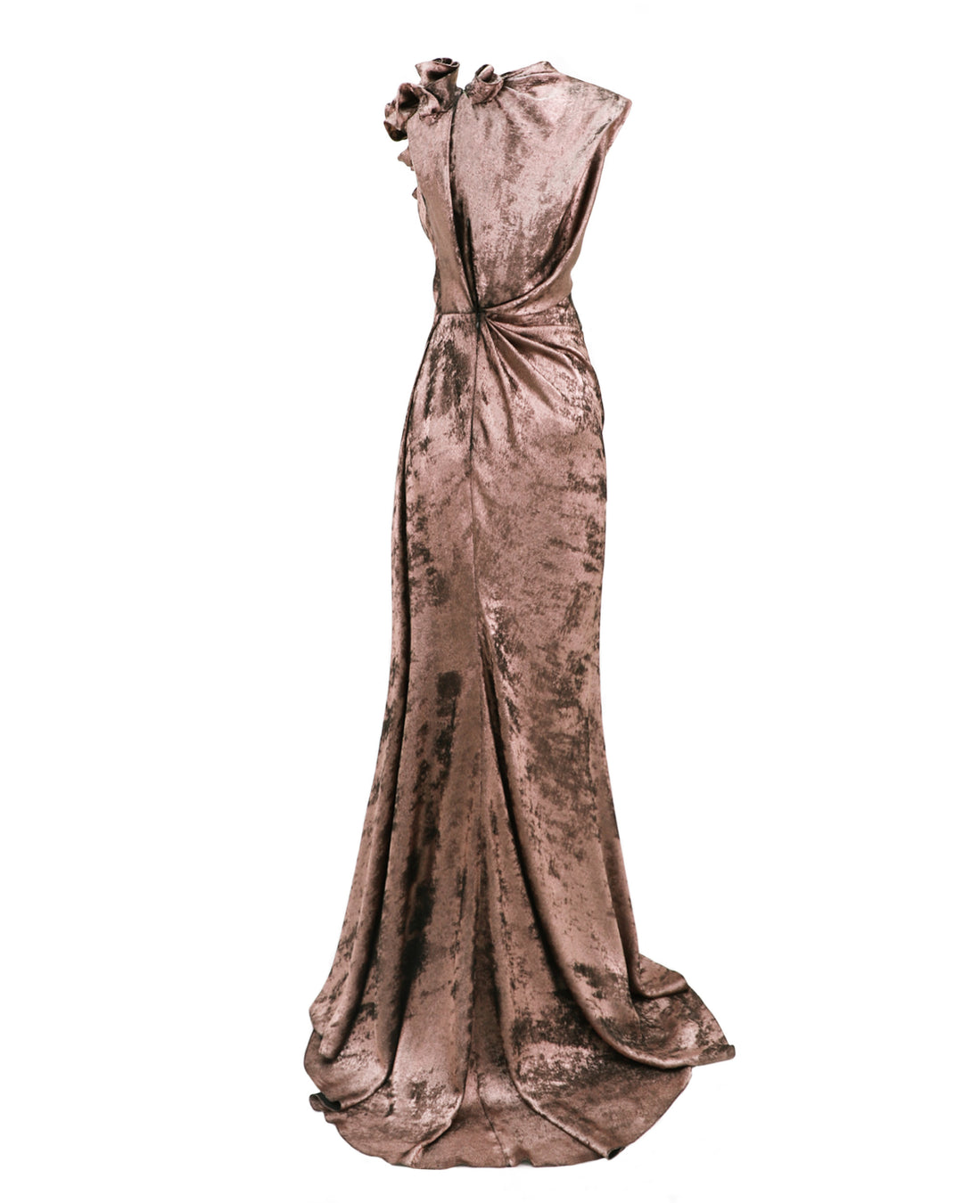 The back of a long draped evening dress in metallic pink with flowers on the shoulder and draping on the waist.