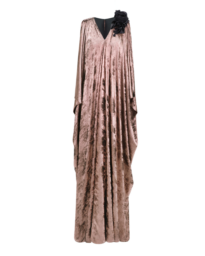 A v-neckline loose-cut kaftan dress in metallic pink with floral draping on the shoulder.