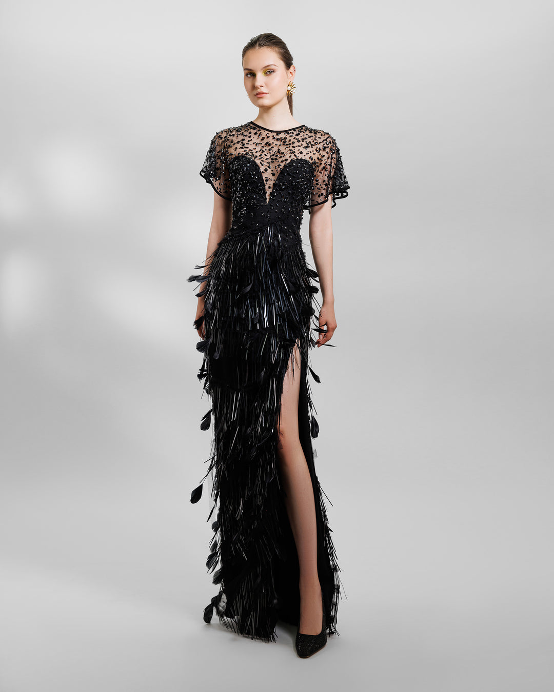 Beaded corset slim-cut feather black evening dress featuring a slit on the side and a see-through back.