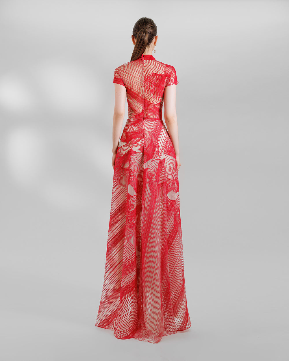 The back of a red flared evening dress with high-neck and short sleeves.