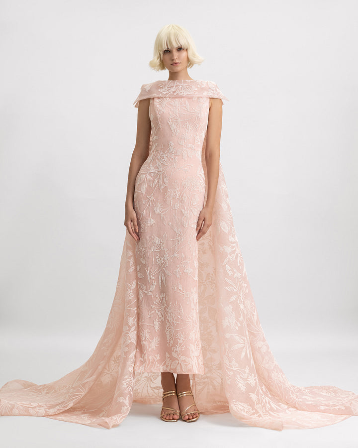 A slim-cut evening dress in light pink pleated organza Jacquard featuring a reversed collar and a long cape.