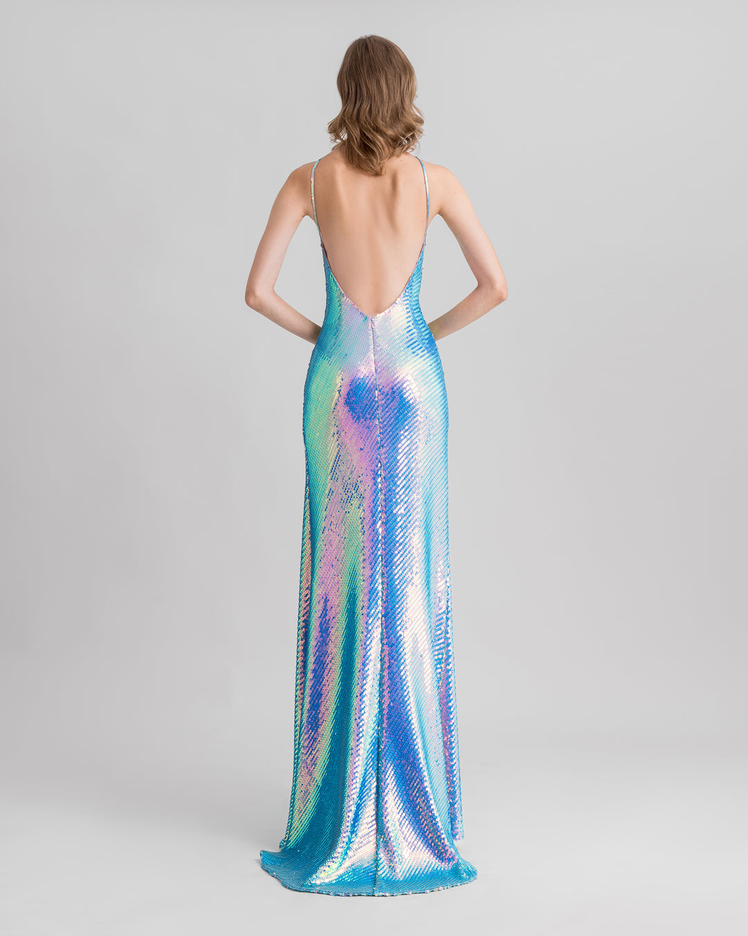 A fully open back slim-cut blue sequined evening dress.