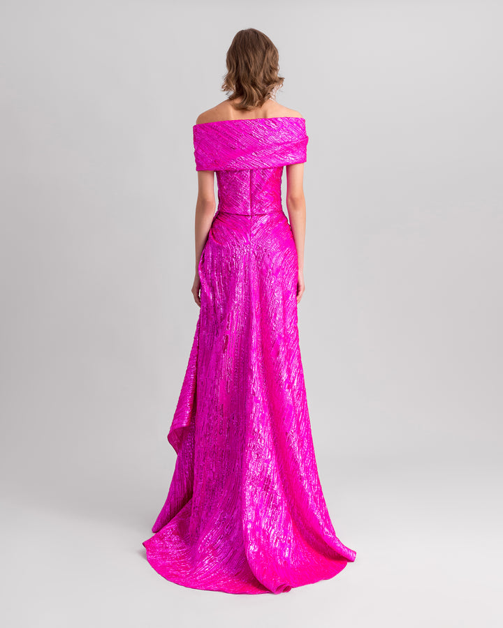 The back of an off-the-shoulders fuchsia evening dress with a draped waist.