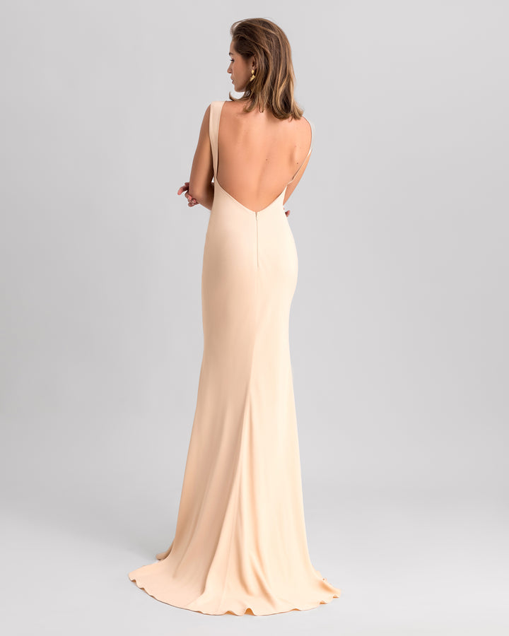 A low open back slim-cut beige evening dress.