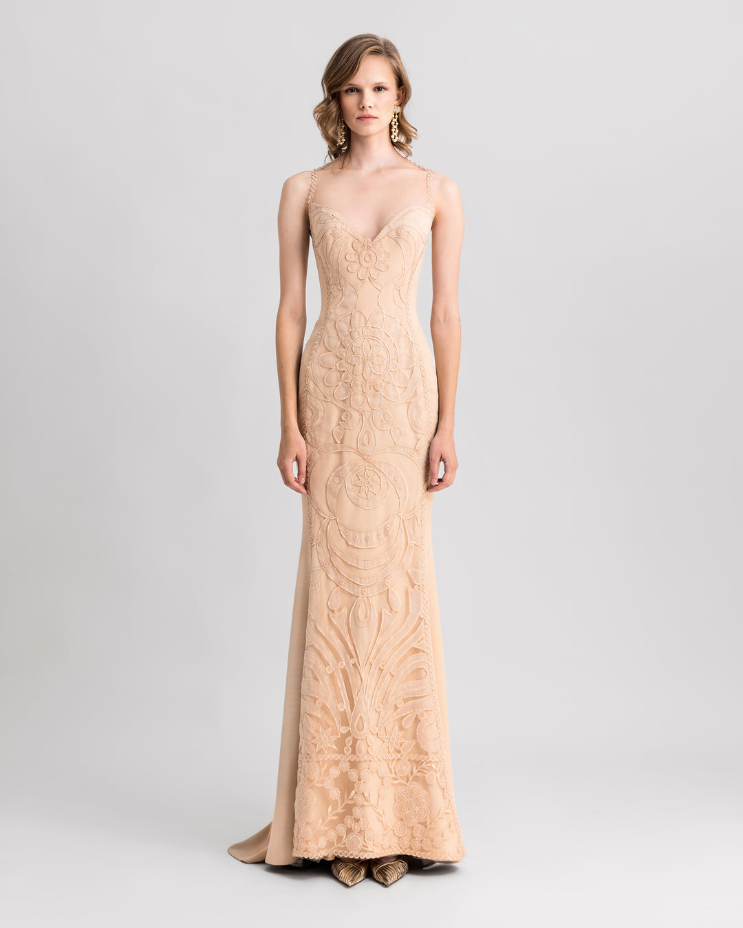 A v-neckline, slim-cut lace evening dress in beige color.