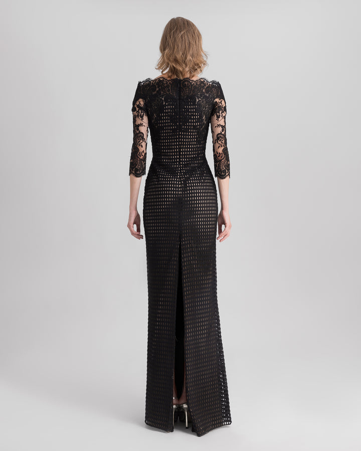 The back of an off-the-shoulders, black crochet lace evening dress.