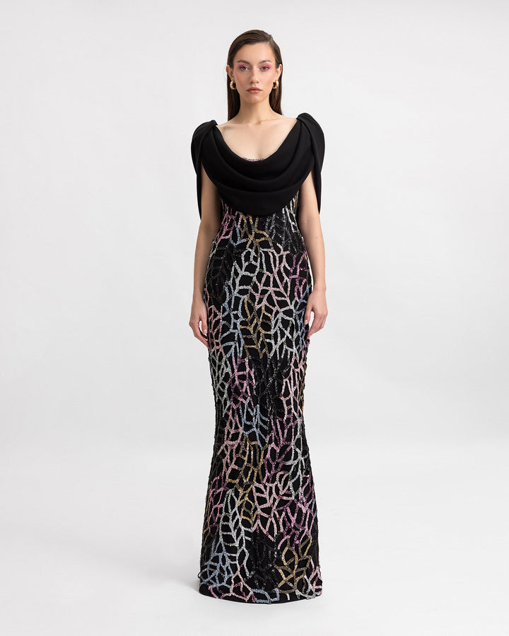 A slim-cut beaded evening dress with draped crepe cape-like sleeves.