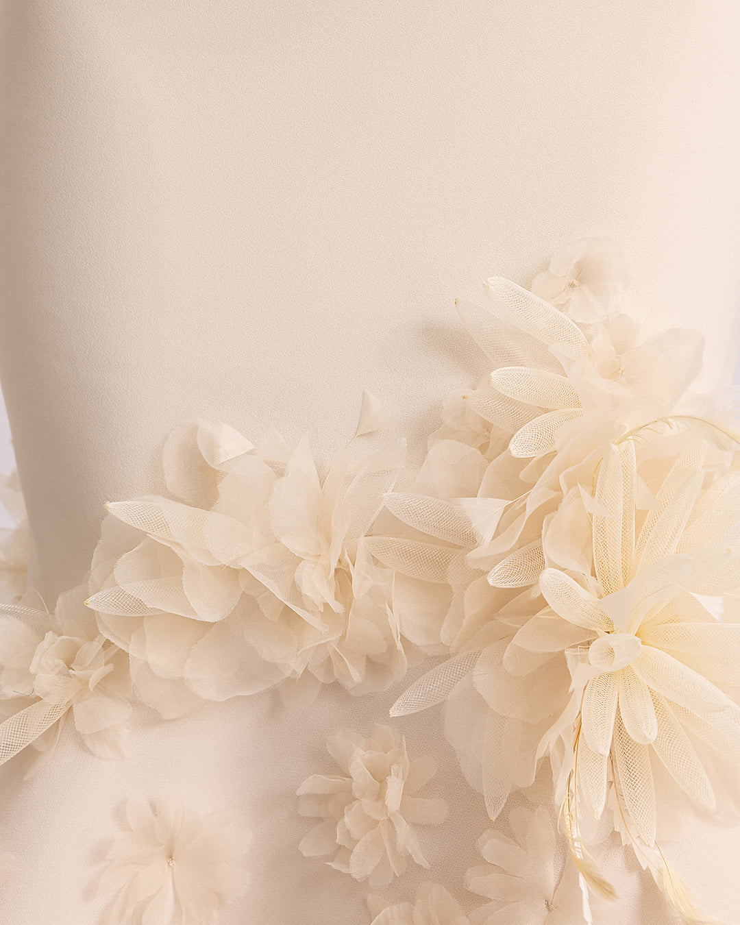 A close-up of a champagne color 3D flower details.