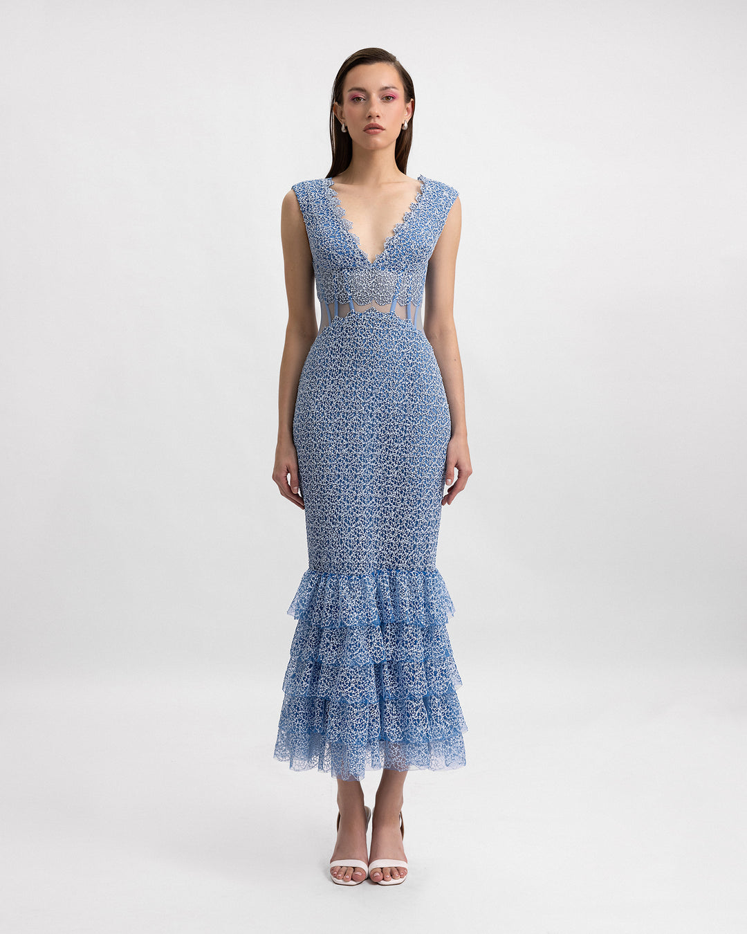 A v-neckline blue midi dress featuring a see-through corset and a ruffled hemline.