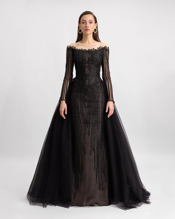 An off-the-shoulders long sleeves evening dress in a laser cut embroidery fabric with a full tulle tail.