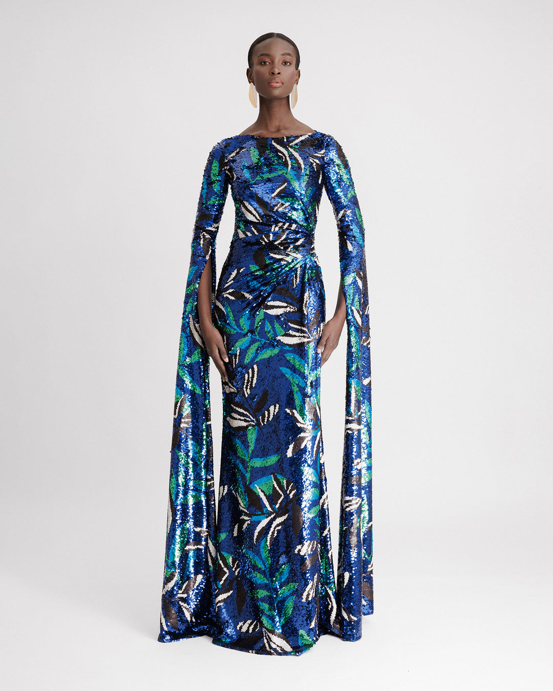 A slim-cut evening dress featuring draping on the waistline and floor-length sleeves in blue patterned sequins fabric.