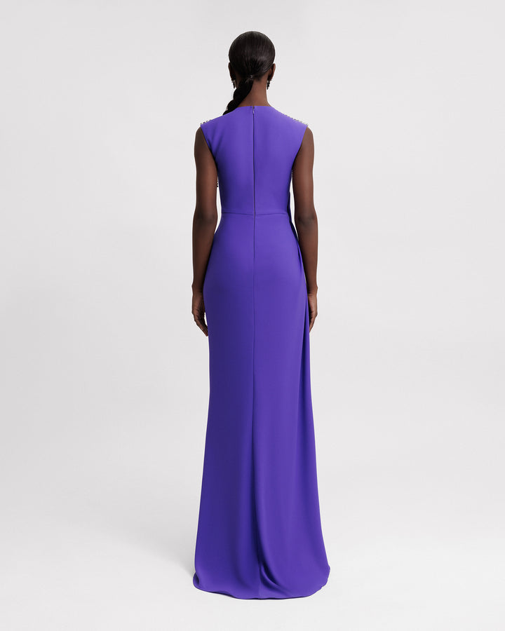 The back of a slim-cut purple evening dress.