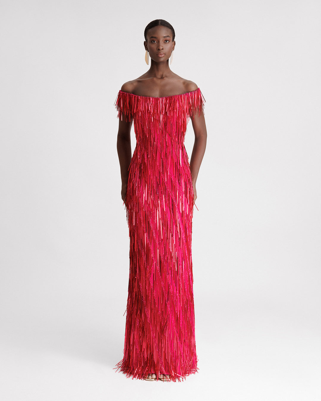 An off-the-shoulders, slim-cut, fully beaded fringes evening dress in fuchsia color.